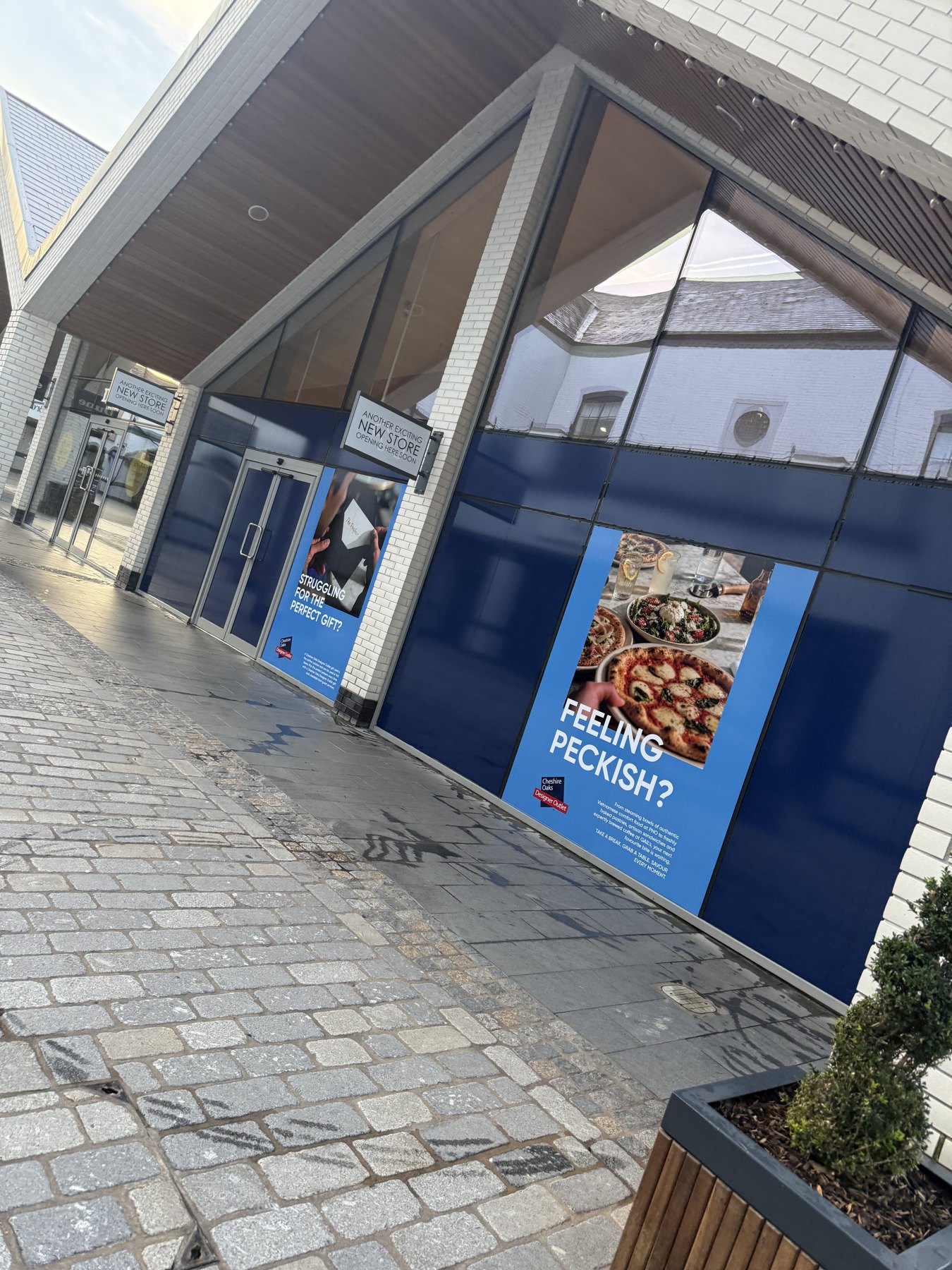 Wrapped retail frontage. Printed graphics wrapped across a shop front.